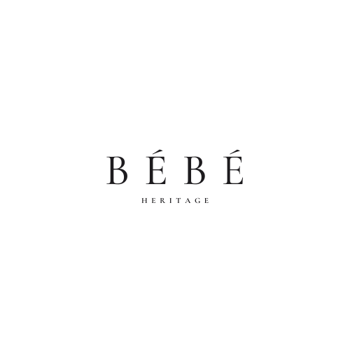 White background and black writing with the words Bebe Heritage. 